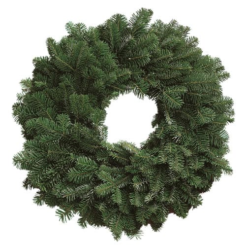 A circular wreath made of green pine branches, arranged densely with a hole in the center, shown on a white background.