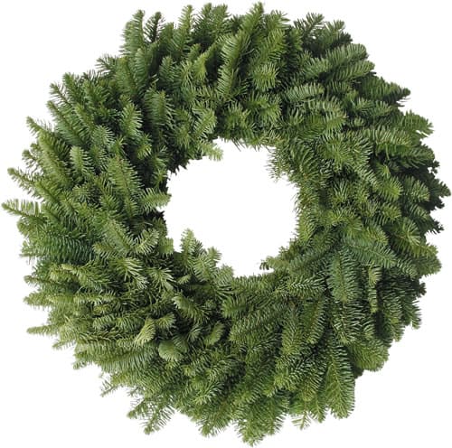 A green holiday wreath made of pine branches arranged in a circular shape, viewed from above against a white background.