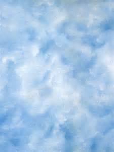 A soft, cloudy sky with varying shades of blue and white, creating a calm and airy atmosphere.