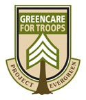 Shield-shaped logo with GreenCare for Troops above a tree graphic, and Project Evergreen below. Colors are green, brown, and beige.