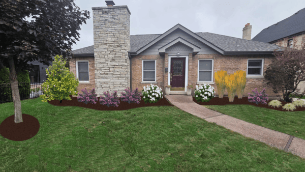 Single-story brick house with a stone chimney, surrounded by a well-kept lawn, flower beds with colorful shrubs, small trees, and a curved walkway leading to the front door under a cloudy sky.